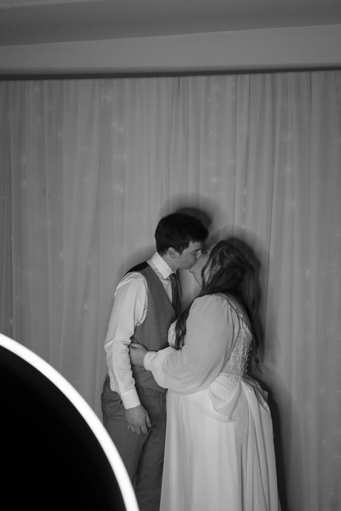 bride and groom in photo booth