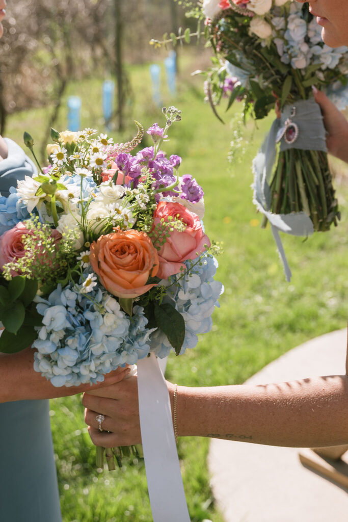 ceremony bride handing off flowers